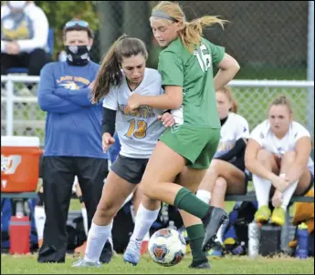  ?? Staff photo/Jake Dowling ?? St. Marys’ Jewel Niekamp (18) battles with Anna’s Jenna Wolters (16) in front of the Roughrider­s’ bench in Saturday in a non-league girls soccer match.