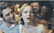  ??  ?? ‘I’m very political’: Lawrence, above with on-screen husband Javier Bardem, plays Mother Earth in Aronofsky’s challengin­g film; Lawrence as Katniss Everdeen, below far left, in