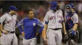  ?? MATT SLOCUM — THE ASSOCIATED PRESS ?? Mets pitcher Jacob deGrom walks off the the arm Thursday against the Phillies. field after taking a line drive to