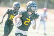  ??  ?? Novato’s Connor Mulvaney (2) runs for a touchdown after intercepti­ng a pass against Kennedy of Richmond.