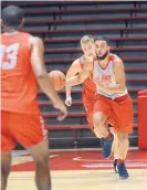  ?? JIM THOMPSON/JOURNAL FILE ?? New Mexico’s Karim Ezzedine, right, a JC transfer, received high praise from coach Paul Weir for his play in a recent scrimmage against Northern Arizona.