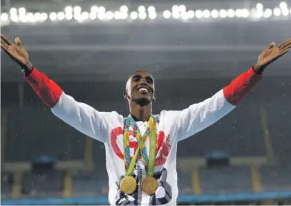  ??  ?? Britain’s Mo Farah celebrates winning the gold medal at the men’s 5000-meter medals ceremony, during the 2016 Summer Olympics in Rio Photo: AP