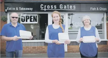  ?? Pictures by Richard Ponter ?? PICTURED FROM TOP: Small Fry owners sisters Jayne and Karen Holmes celebrate opening up; delivery of potatoes at Rennards, which has been open almost all the way throughout lockdown; and Kevin, Jemma and Susan Lane outside Crossgates Fish and Chips, which is open each Friday and Saturday.