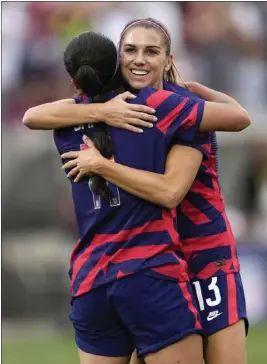  ?? DAVID ZALUBOWSKI — THE ASSOCIATED PRESS ?? U.S. forward Alex Morgan, right, said she's made an effort to be more vocal on the field.