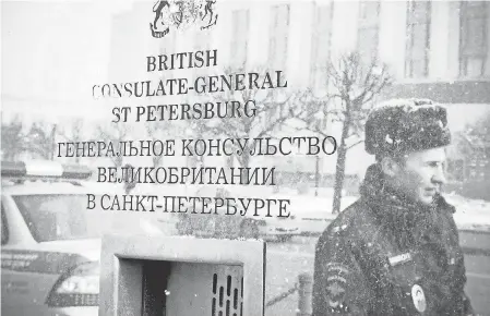  ??  ?? Russian police guard the British Consulate General building in St. Petersburg on Saturday. OLGA MALTSEVA/AFP/GETTY IMAGES