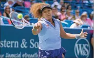  ?? Cara Owsley / Associated Press ?? Naomi Osaka hits the ball to Cori Gauff during the Western & Southern Open in Mason, Ohio on Aug. 18.