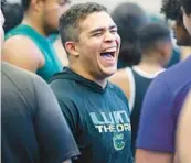  ?? STEPHEN M. DOWELL/ORLANDO SENTINEL ?? Lake Minneola weightlift­er Roy Wiggins has a laugh with teammates during a district meet at Evans High School last month. Wiggins was a 2022 state champion as a junior.