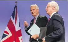  ??  ?? EU chief Brexit negotiator Michel Barnier, left, and British Secretary of State for Exiting the EU David Davis in Brussels Monday.