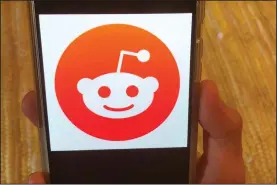  ?? (AP/Tali Arbel) ?? Reddit, a much-used public comment website whose logo is shown Monday on a mobile device, has banned a pro-Trump forum as part of a crackdown on hate speech.