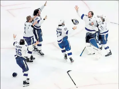  ?? Bruce Bennett / Getty Images ?? Lightning players celebrate following their series-winning 2-0 victory against the Stars in Game 6 of the Stanley Cup Final on Monday at Rogers Place in Edmonton, Alberta.