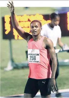  ?? PHOTO BY RICARDO MAKYN MULTIMEDIA PHOTO EDITOR ?? Jaheel Hyde waves to the crowd after his second-place finish in the men’s 400m hurdles event at the Jamaica Internatio­nal Invitation­al meet held at the National Stadium on May 20.