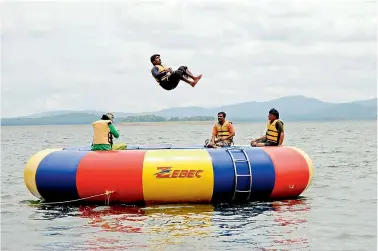  ??  ?? What a leap! (trampoling in Bhadra reservoir in Karnataka)