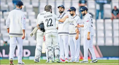  ?? GETTY ?? New Zealand skipper Kane Williamson hugs his Indian counterpar­t Virat Kohli after winning the World Test Championsh­ip final at The Ageas Bowl on Wednesday.