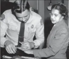  ?? GENE HERRICK — THE ASSOCIATED PRESS FILE ?? In this file photo, Rosa Parks is fingerprin­ted by police Lt. D.H. Lackey in Montgomery, Ala., after refusing to give up her seat on a bus for a white passenger on. Yellowing court records from the arrests of Rosa Parks, Martin Luther King Jr. and...