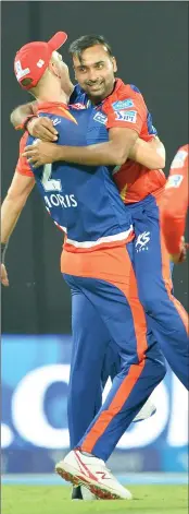  ??  ?? Amit Mishra celebrates the wicket of Jos Buttler with Cris Morris during the match against Mumbai Indians on Saturday. Along with Jos Butler, he as well dismissed to dangerous going Ambati Rayudu.