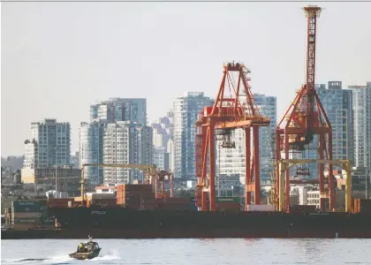  ?? JAMES MACDONALD/BLOOMBERG FILES ?? The Vancouver Port reported that overall cargo volumes climbed a record-smashing seven per cent to 76.4 million metric tonnes in the first half of the year, led by grains. The port hopes to finish expansion projects to deal with a projected volume surge.