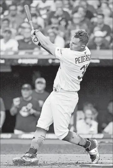  ?? Jason Miller Getty Images ?? THE DODGERS’ Joc Pederson reached the Home Run Derby semifinals Monday night but lost 40-39 in a thrilling, long-lasting matchup against Blue Jays rookie Vladimir Guerrero Jr. “It was special,” Pederson said.