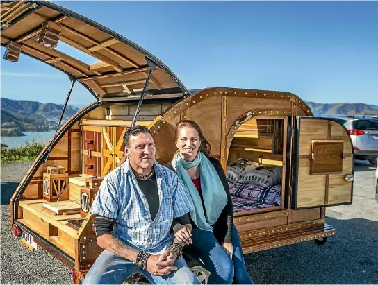  ?? JOHN KIRK-ANDERSON/ STUFF ?? Carlton Pezaro made his homemade teardrop caravan from recycled wood for his wife Sarah.