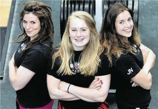  ?? Photograph­s: Colin Rennie ?? CHASING THE MEDALS: Sudents, from left, Eve Fordyce, Molly Tweedle and Jennifer Newton.