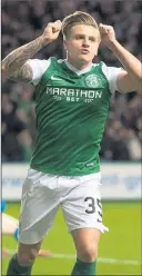  ??  ?? HEADWAY: Forward Jason Cummings celebrates opening strike for Hibs