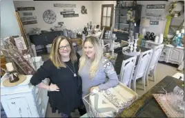  ?? STAFF PHOTOS BY DARWIN WEIGEL ?? Sisters Whitney Muenze, left, and Ashley Rankin, both of Marbury, opened Vintage Redeux in Indian Head on Nov. 4. The two make and refinish furniture and signs in the distressed style.