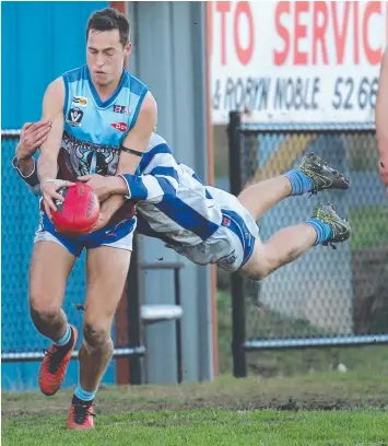  ?? Pictures: MARK WILSON ?? HANGING ON! Modewarre’s Callum Bourke is grabbed by Dyson Bell-Warren.