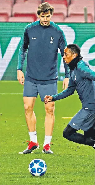  ??  ?? Warming up: Kyle Walker-peters gets away from Harry Kane as Spurs get used to the Nou Camp pitch last night