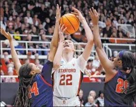  ?? Josie Lepe The Associated Press ?? Mississipp­i guard Ayanna Thompson, right, and forward Madison Scott pressure Stanford forward Cameron Brink in the first half of the eighth-seeded Rebels’ 54-49 win Sunday at Maples Pavilion.