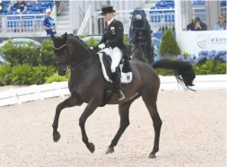  ??  ?? Jessica von Bredow-Werndl and the inexperien­ced 11-year-old mare TSF Dalera BB, by Easy Game, are the overnight leaders for Germany