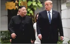  ?? Getty Images/tns ?? President Donald Trump (R) walks with North Korea’s leader Kim Jong Un during a break in talks at the second U.s.-north Korea summit at the Sofitel Legend Metropole hotel in Hanoi on Feb. 28.