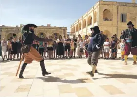  ?? ?? Re-enactors during a sword fight at a previous open day at the fort.