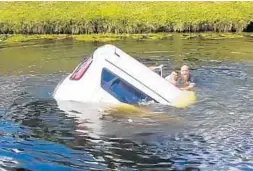  ?? SHAWN TURNER/COURTESY PHOTOS ?? Shawn Turner helps rescue a woman inside a sinking SUV in a canal outside Boca Raton.