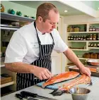  ??  ?? Wharekauha­u Country Estate executive chef Marc Soper prepares his dish for the O¯ ra King Salmon awards last year.