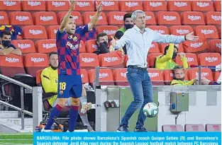  ?? —AFP ?? BARCELONA: File photo shows Barcelona’s Spanish coach Quique Setien (R) and Barcelona’s Spanish defender Jordi Alba react during the Spanish League football match between FC Barcelona and Club Atletico de Madrid at the Camp Nou stadium in Barcelona on June 30, 2020.