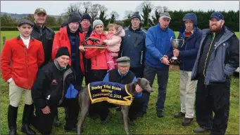  ??  ?? Walter Costello and Paddy Herlihy presenting the cups to Tom and Aoife O’Connor and N. Menn after Tom’s dog, Cruyff, won the Derby Trial Stakes at Castleisla­nd Coursing on Monday.