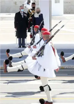  ??  ?? The Prince of Wales and the Duchess of Cornwall attend the Greek Independen­ce Day Military Parade in Athens yesterday as part of a two-day visit to celebrate the bicentenar­y of Greek independen­ce. Charles was awarded the City of Athens Gold Medal of Honour.