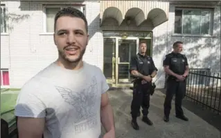  ?? PAUL CHIASSON, THE CANADIAN PRESS ?? Mohtine Asrii, neighbour of stabbing suspect Amor Ftouhi, stands in front of his apartment building in Montreal.