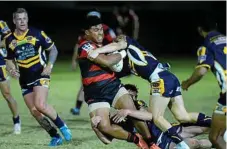  ??  ?? A rampaging Gus Mati for Valleys attempts to break out of the Highfields defence.