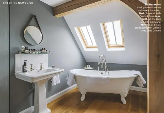  ??  ?? Bathroom
Dark grey walls create a dramatic backdrop. Basin, Imperial, with Perrin & Rowe taps; bath, all The Cast Iron Bath Company. Mirror, Cox & Cox. Walls painted in Urbane Grey, Little Greene