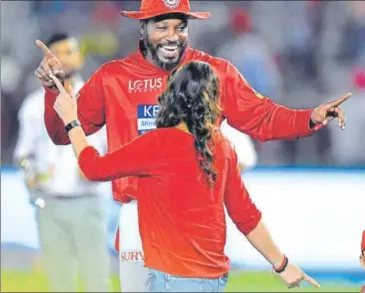  ?? AFP ?? Kings XI Punjab’s Chris Gayle celebrates victory over Sunrisers Hyderabad with team coowner Preity Zinta on Thursday.