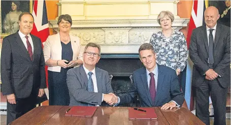  ?? Picture: Getty Images. ?? Prime Minister Theresa May, second right, stands with First Secretary of State Damian Green, right, Democratic Unionist Party (DUP) leader Arlene Foster and DUP deputy leader Nigel Dodds, left, as DUP MP Jeffrey Donaldson shakes hands with...