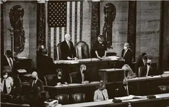  ?? Erin Scott / Associated Press ?? Speaker of the House Nancy Pelosi, D-Calif., and Vice President Mike Pence officiate as a joint session of the House and Senate convenes to confirm the Electoral College votes.