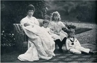  ??  ?? Queen Mary and four of her children photograph­ed in 1905