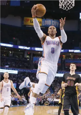  ?? AP FOTO ?? ALL AROUND. Russell Westbrook tallied his 28th triple double of the season in Oklahoma’s 33rd win in 58 games. Westbrook now has 65 in his career, just trailing Wilt Chamberlai­n’s 78.