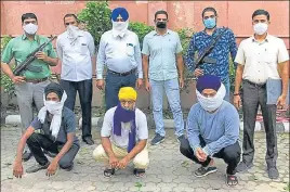  ??  ?? The accused (squatting) in the police custody on Saturday. The three men were arrested from Delhi, Punjab and Haryana in separate operations in the last 10 days. HT PHOTO