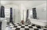  ??  ?? aCreS Of SpaCe: The main bathroom, with freestandi­ng roll-top bath, is enormous