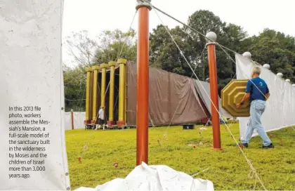  ?? STAFF FILE PHOTO BY DAN HENRY ?? In this 2013 file photo, workers assemble the Messiah’s Mansion, a full-scale model of the sanctuary built in the wilderness by Moses and the children of Israel more than 3,000 years ago.