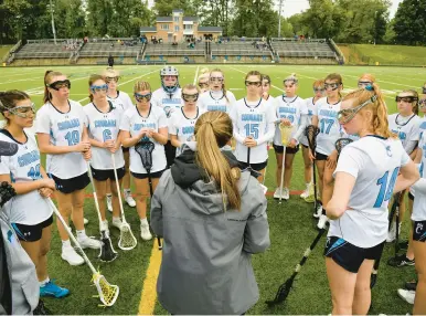  ?? PAUL W. GILLESPIE/CAPITAL GAZETTE PHOTOS ?? Chesapeake coach Kaitlyn Hines speaks with her team before Tuesday’s game vs. Severna Park.