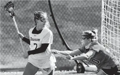  ?? AMY DAVIS/BALTIMORE SUN PHOTOS ?? Towson’s Molly Lynch is pressured by Stony Brook’s Ally Kennedy during Sunday’s game.