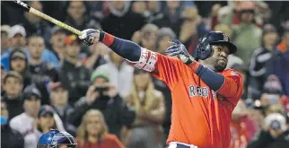  ?? ELISE AMENDOLA/ THE ASSOCIATED PRESS ?? Boston Red Sox slugger David Ortiz hits a game-winning two-run homer off Toronto pitcher Brett Cecil in the seventh inning of Friday’s MLB game at Fenway Park.